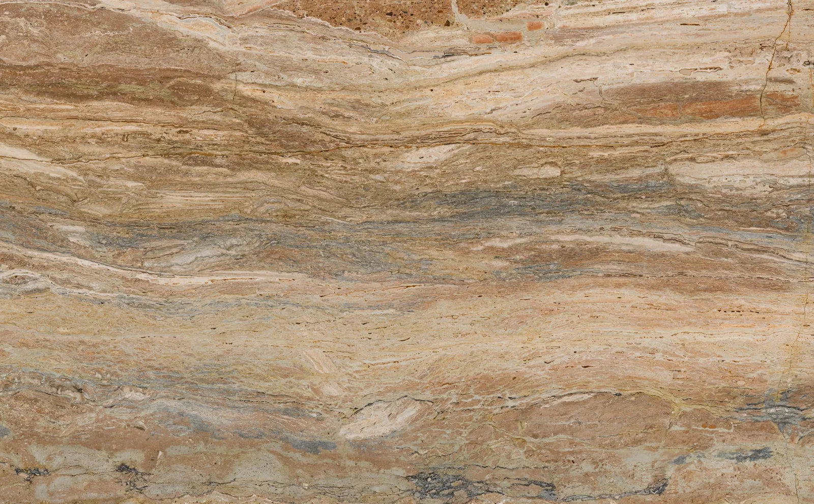 Polished travertine slab showing the warm beige, gold, rust and soft grey colour range that defines 2026 interiors